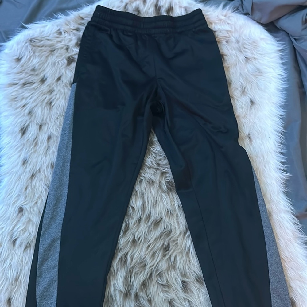 Black pants with thick gray strip, going down the side, both sides.
